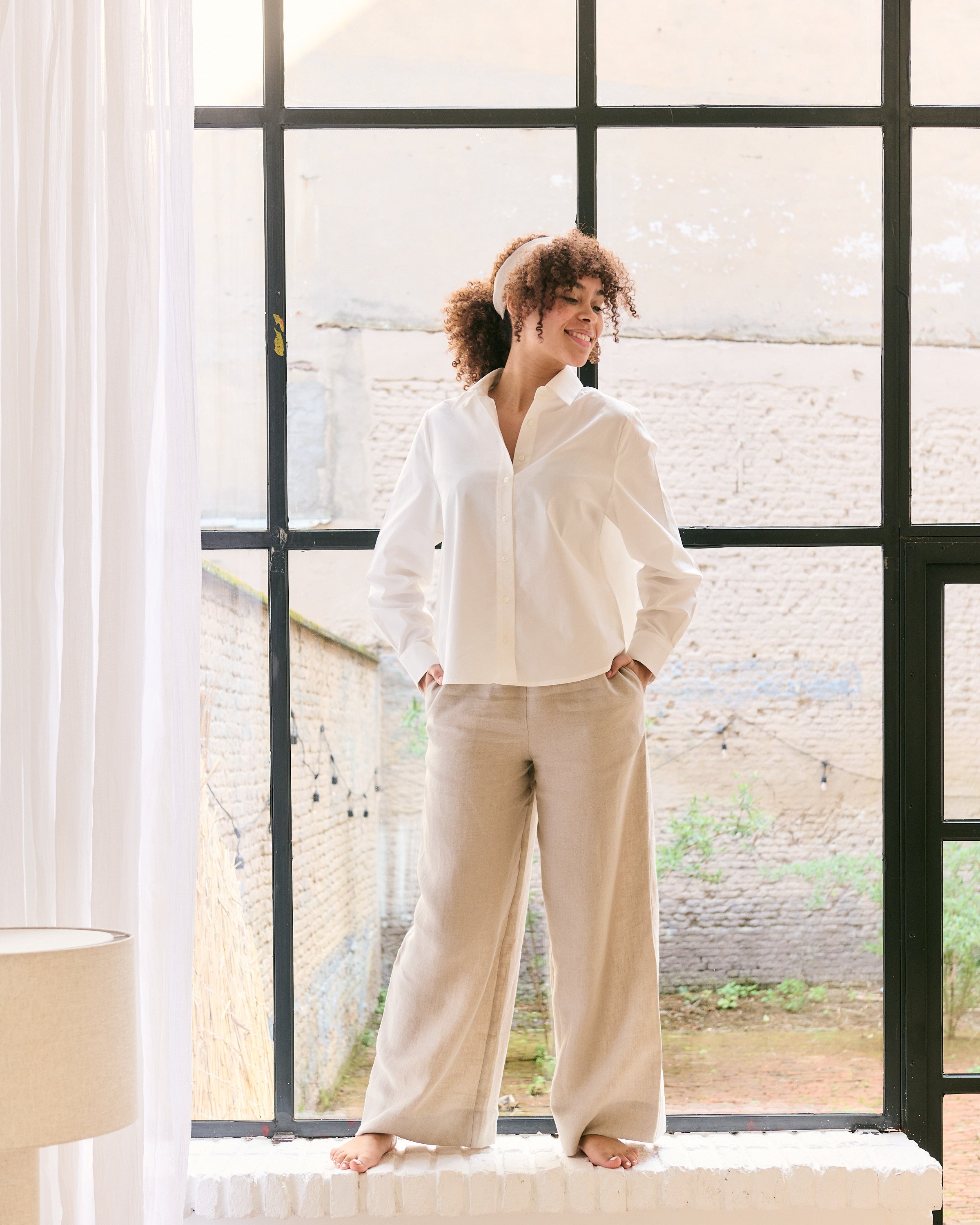 Offwhite cotton shirt and natural linen pants.