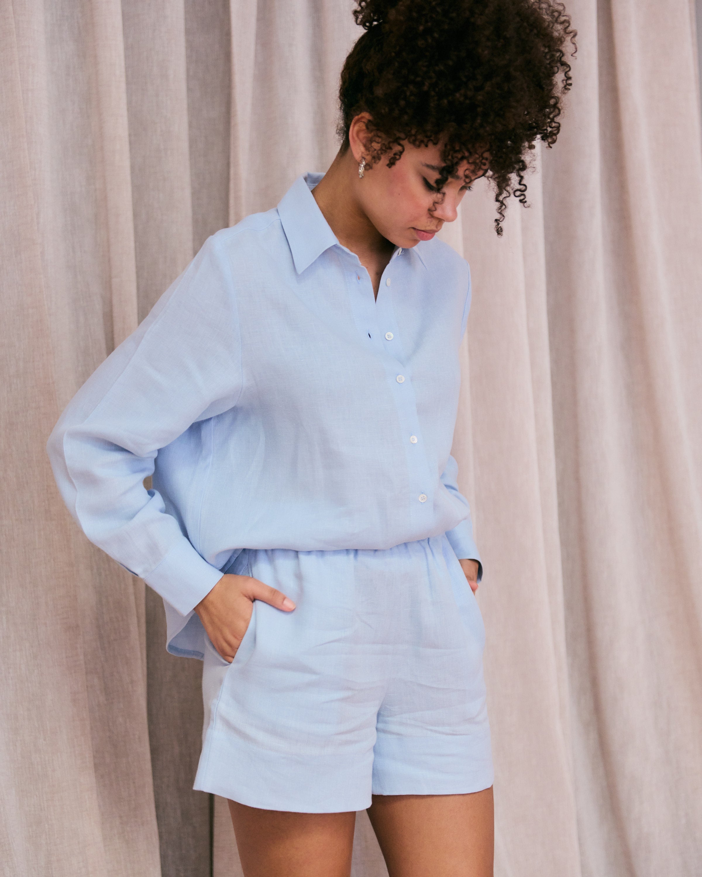 Comfortable light blue linen shirt and shorts.