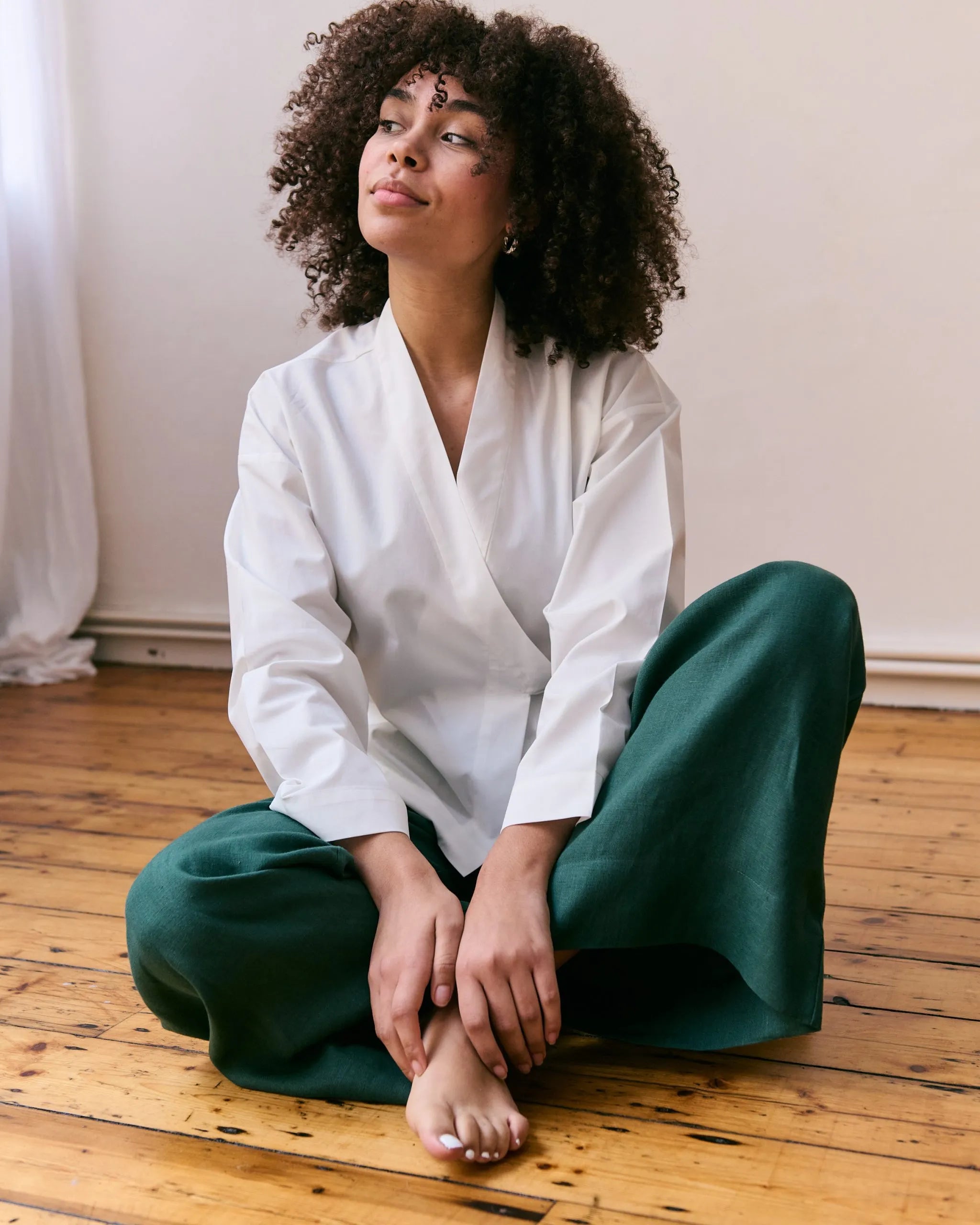 Off-white wrap blouse in 100% organic cotton.