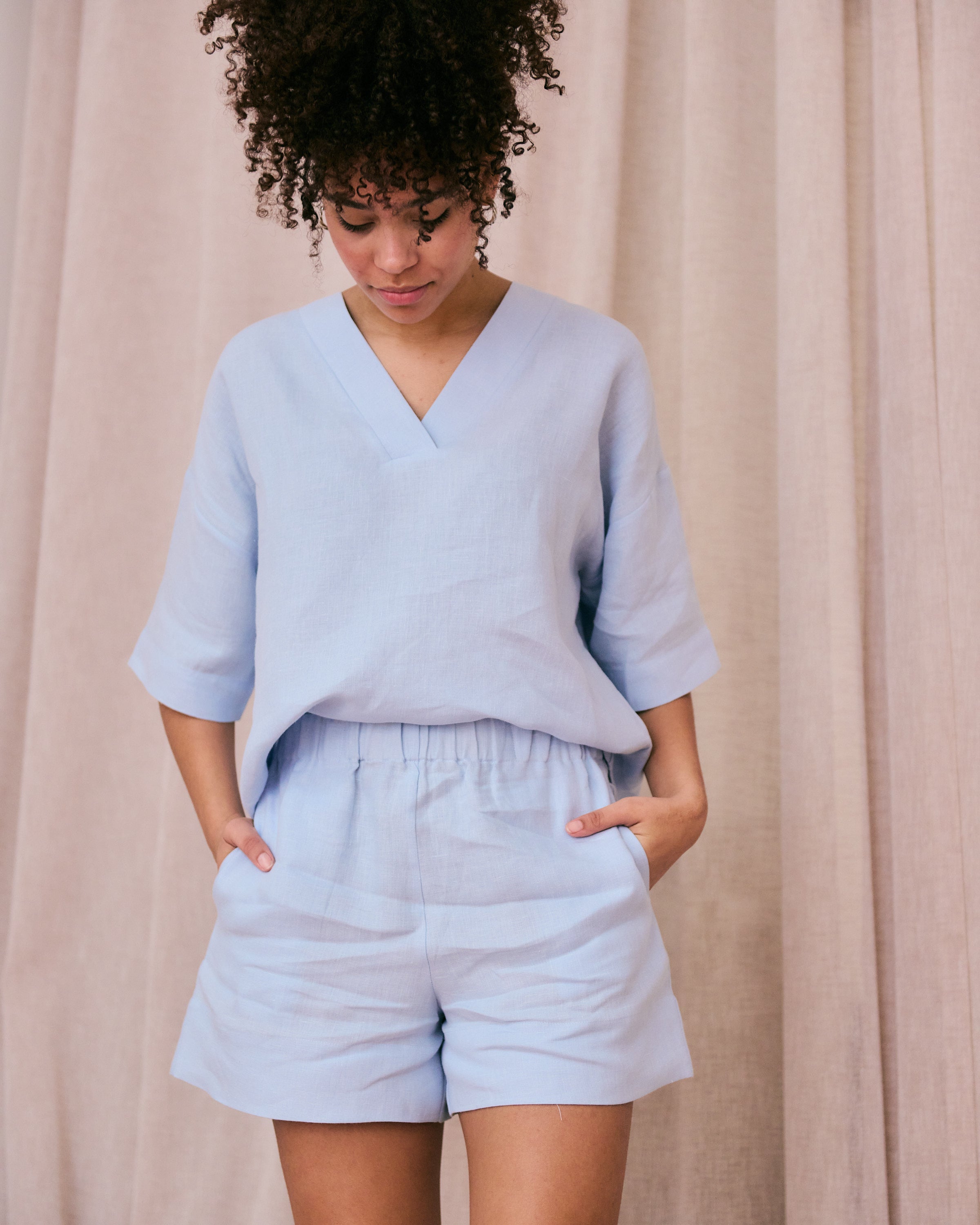 Comfortable light blue linen top and shorts.