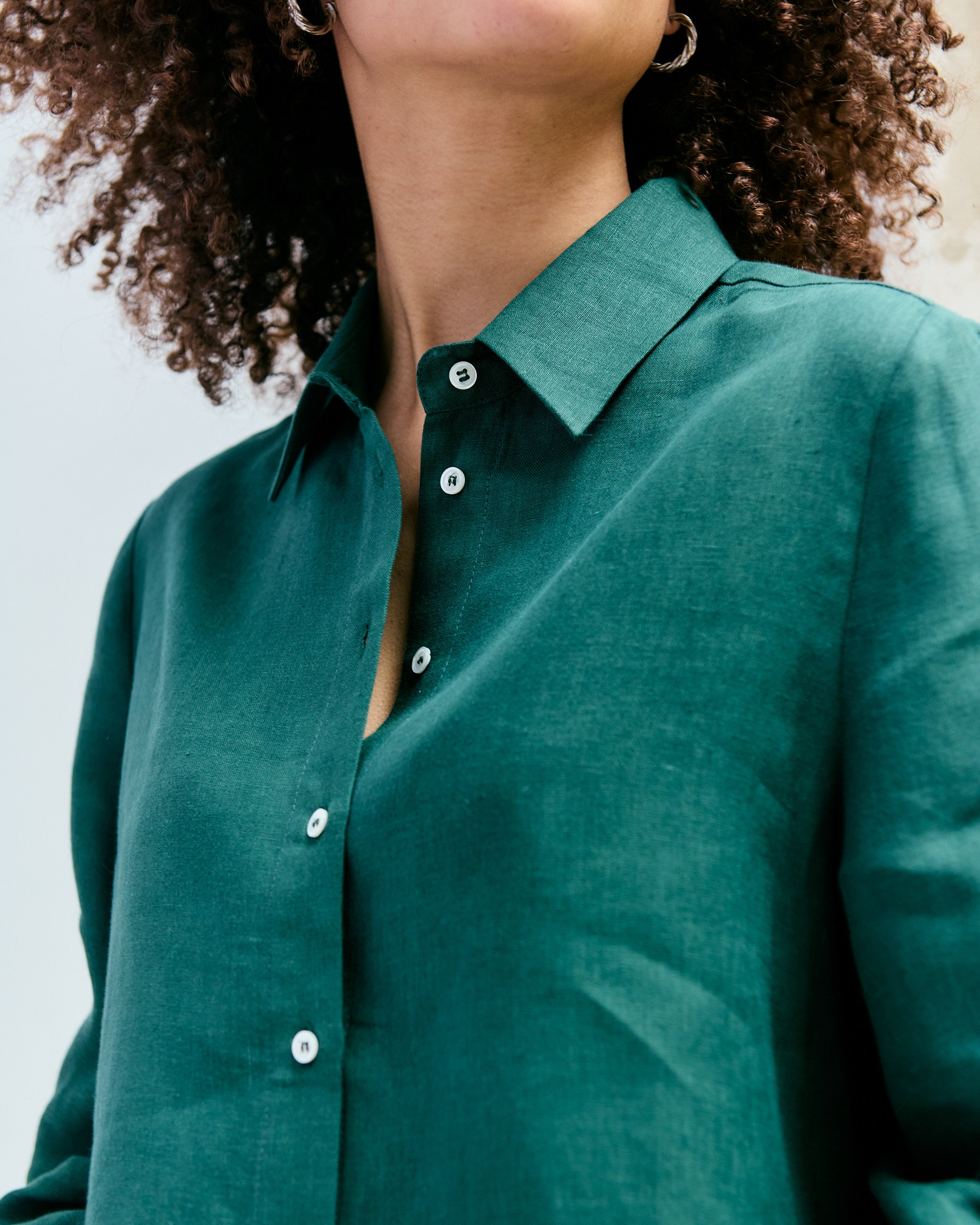 Detail of a green linen shirt.